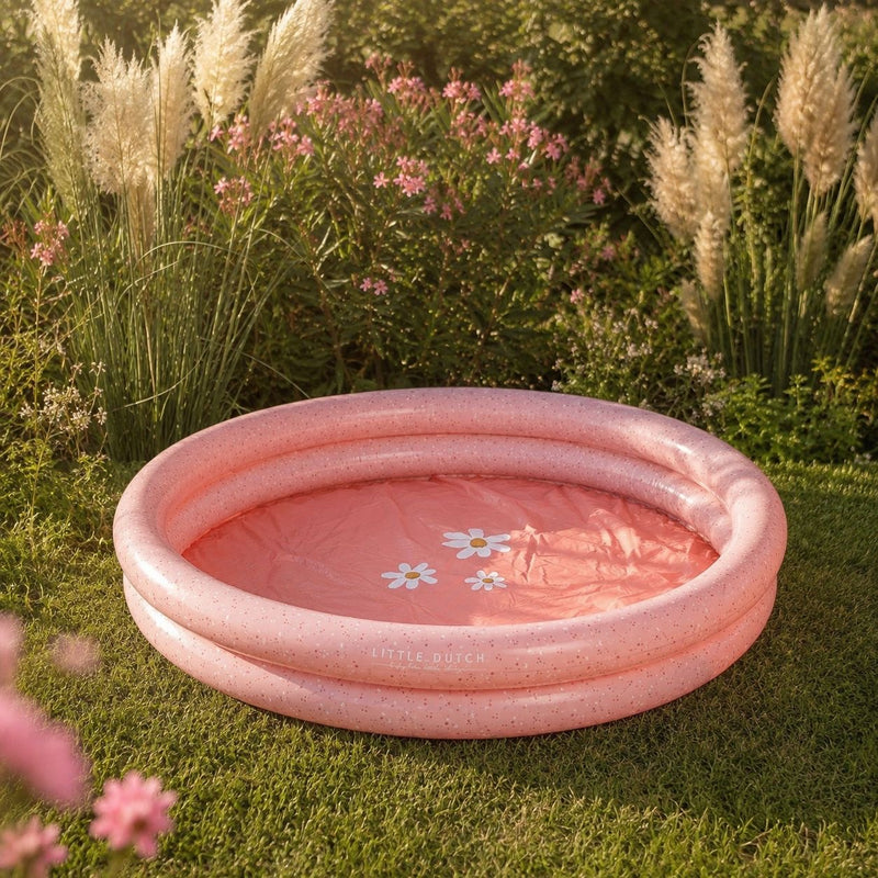 Rosa Kinderpool für Babys und Kleinkinder im Garten mit Blumenmotiv – aufblasbares Planschbecken für Wasserspaß im Sommer.